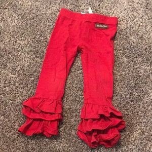 Cute red ruffled pants.